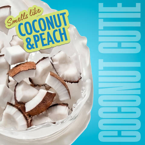 Frische Kokosnussstucke in einem weißen Cremesplash illustrieren den Duft „Coconut & Peach“ der Variante „Coconut Cutie“.