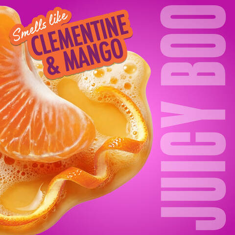 Eine saftige Clementine in einem fruchtigen Splash illustriert den Duft „Clementine & Mango“ der Variante „Juicy Boo“.